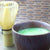 Matcha in bowl with crema and bamboo whisk from KenkoTea